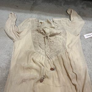 Brand new dress with tags, mid length with jewelry ties